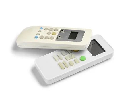 Modern air conditioner remote controls isolated on white background Stock Photos