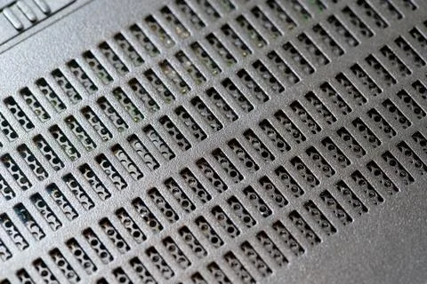 Modern air flow grid on generic appliance electronics, macro detail of metallic Foto stock