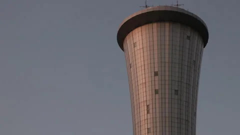 Modern air traffic control tower against twilight sky at Ben Gurion Airport Stock Footage 344745025