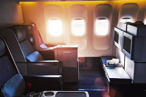 Modern airplane interiors, first class seats Stock Photos