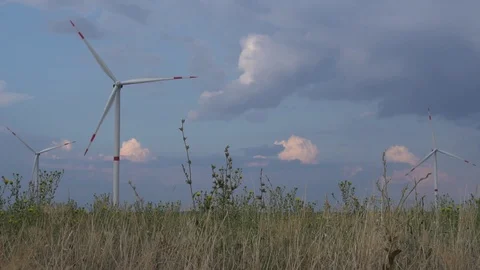 Modern alternative environment renewable energy source farm with wind turbines Stock Footage 94535704