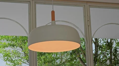 Modern and minimal light hangs on the ceiling. Stock Footage 304437248