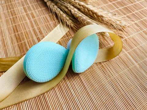 Modern and tiny cleansing silicone brush on bamboo with authentic look Stock Photos