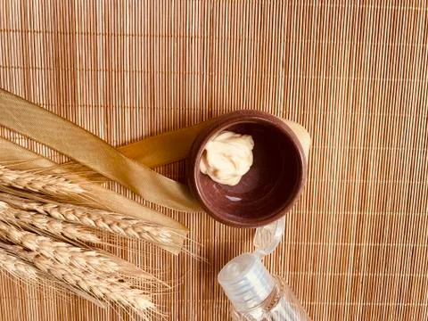 Modern and tiny cleansing silicone brush on bamboo with authentic look Stock Photos