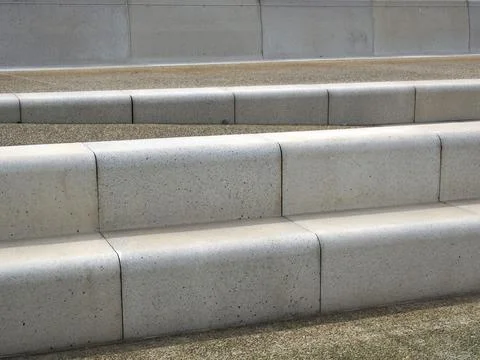 Modern angled outdoor steps with rounded corners int textured grey and brown Stock Photos
