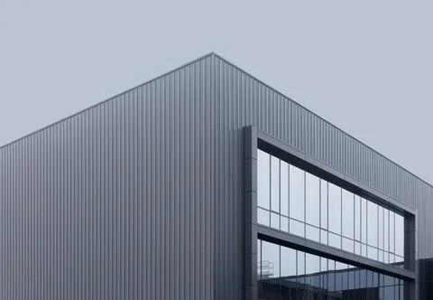 Modern angular building with metal facade and glass window corner detail. Stock Photos