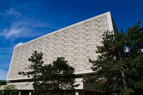 Modern Angular Building with Textured Facade Framed by Green Trees in Indiana Photos