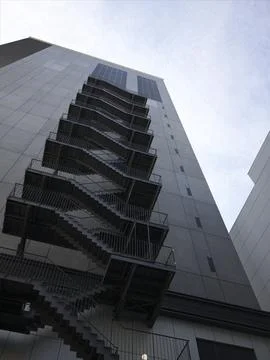 Modern angular office towers and empty city streets, Japan Stock Photos