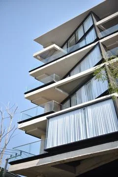 Modern Apartment Building with Unique Angular Concrete Balconies. Stock-Fotos