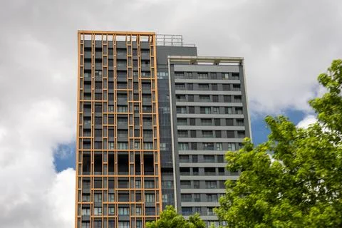 Modern Apartment Complex Against a Cloudy Sky Stock Photos
