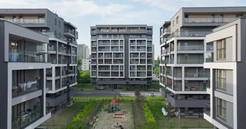 Modern apartment complex – drone shot with central playground Stock Footage 317250645