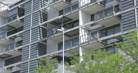 Modern apartment facade with repeating balconies in Madrid 스톡 동영상 335652279