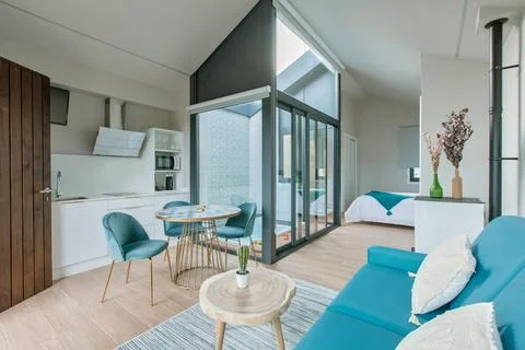 Modern apartment interior with open plan living room, kitchen, and dining a.. Stock Photos