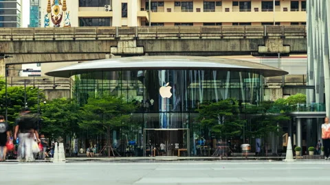 Modern Apple Store building with blurred people motion in a vibrant city street Stock Footage 316089550