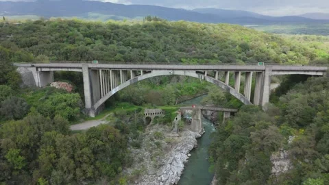 Modern Arch Bridge and Historic Bridge Ruins in Peloponnese Stock Footage 337087218