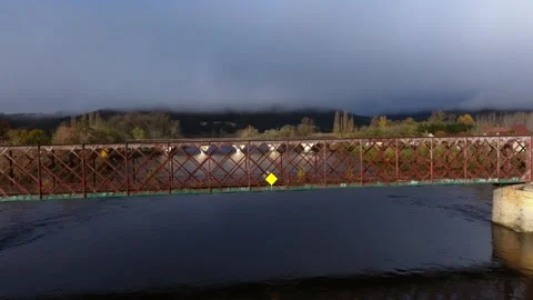 Modern arched bridge in the background over the river. Stock Footage 325716473