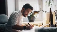 Modern Architect Looking At Blueprint With Sketch Of Construction In Office Stock Footage