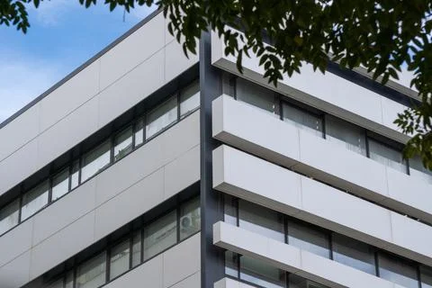 Modern architectural building with geometric design and sky background. Stock Photos