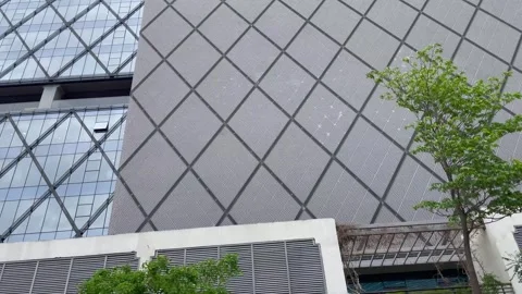 Modern Architectural Building with Geometric Facade and Glass Panels Stock Footage 337722322