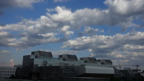 Modern Architectural Building Under Cloudy Sky Vídeos de archivo 303865004