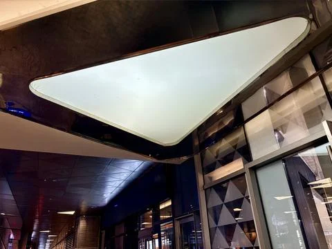 Modern architectural ceiling with geometric design and glass elements. Stock Photos