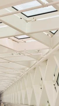 Modern architectural ceiling with geometric patterns and skylights showcases  Stock Photos