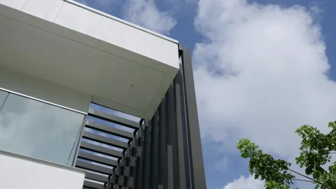 Modern architectural design features clean lines and a beautiful blue sky above Stock Footage 285795122