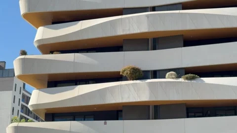 Modern architectural design featuring undulating terraces in Madrid, Spain Stock Footage 347857585
