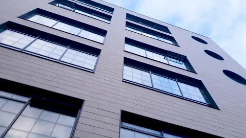 Modern architectural design featuring windows against the backdrop skyline. Stock Footage 344964208