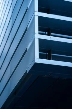 Modern architectural facade featuring geometric shapes and parallel lines 스톡 사진
