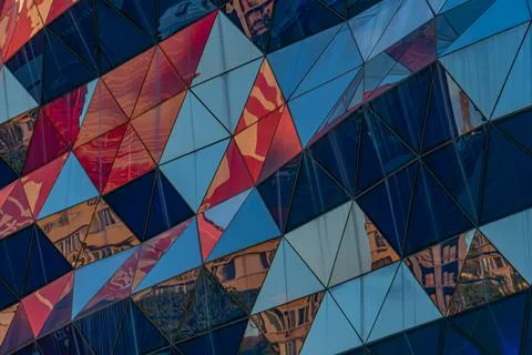 Modern Architectural Facade with Triangular Panels and Vibrant Colors Stock Photos