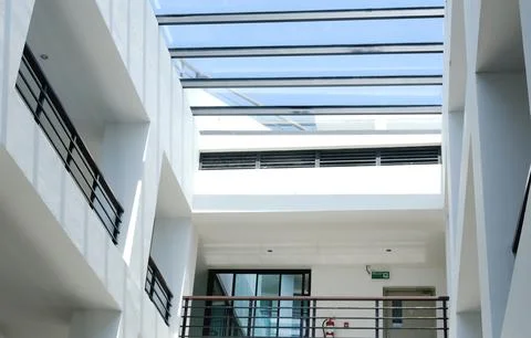 Modern architectural interior featuring a glass ceiling with natural light Stock Photos