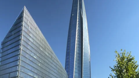 A Modern Architectural Marvel featuring Stunning Glass Facades and a Sleek Stock Footage 286976702