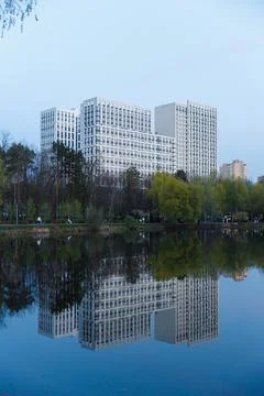 Modern Architectural Marvel Reflected in Tranquil Waters: A Stunning Evening Stock Photos