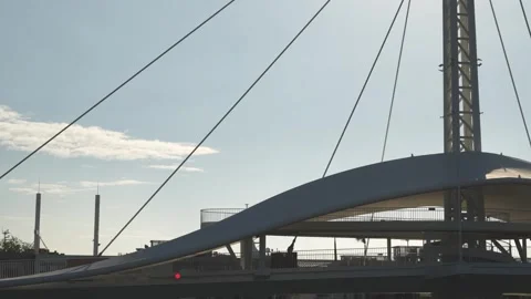Modern architectural structure with cables and central steel column against sky Stock Footage 315737240
