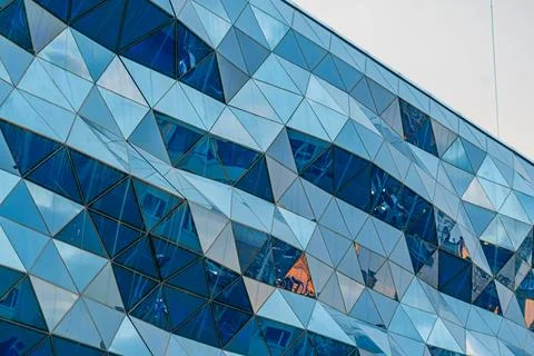 Modern Architectural Structure with Reflective Triangular Panels Stock Photos