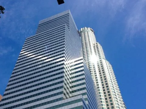 Modern architecture background gleaming sun high rise skyscraper Stock Photos