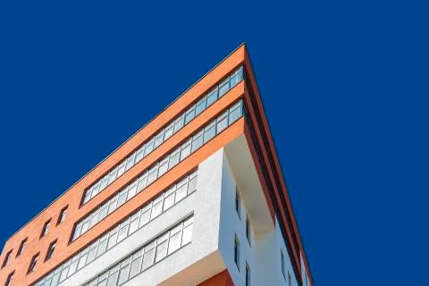 Modern architecture building triangle shape facade red and white color foresh 库存照片
