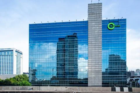 Modern architecture close up with mirror window reflections of building Stock Photos