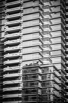 Modern architecture close up with mirror window reflections of building Stock Photos