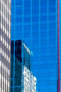 Modern architecture concept, skyscraper reflections in high rise building. Stock Photos