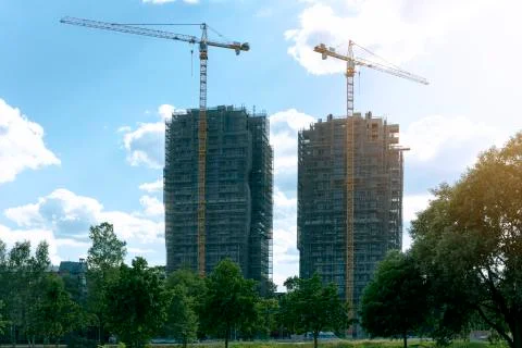 Modern architecture. Construction of skyscraper. Construction site with crane Stock Photos