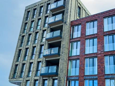 Modern architecture displays sharp lines and contrasting colors in a vibran.. Stock Photos