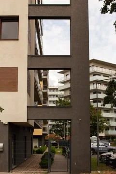Modern architecture features large windows overlooking a serene courtyard Stock Photos