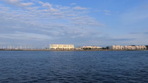 Modern architecture panorama - blue cloudy sky - flying seagull Stock Footage 140672356