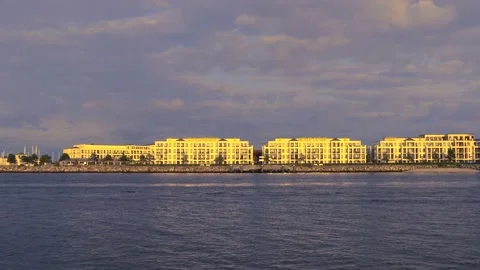 Modern architecture panorama - sunset cloudy sky - flying seagull &amp; cormorant Stock Footage 140659897