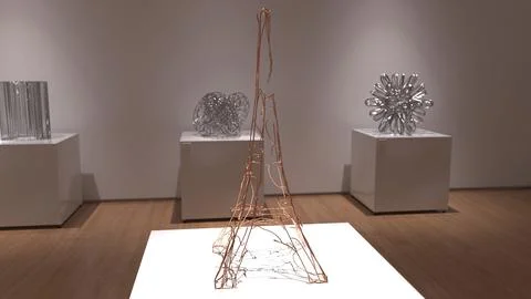Modern art gallery display with wire sculptures on white pedestals in a min.. Stock Illustration