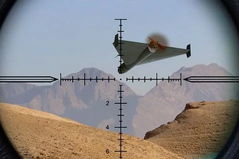 Modern attack drone appears inside a riflescope during aerial tracking abov.. Stock Photos