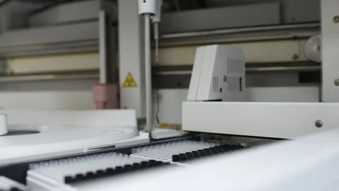 Modern automated machine in the working process, clinical chemistry analyzer Stock Footage 98005575
