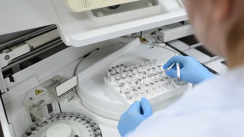 Modern automated machine in the working process, clinical chemistry analyzer Stock Footage 98005649